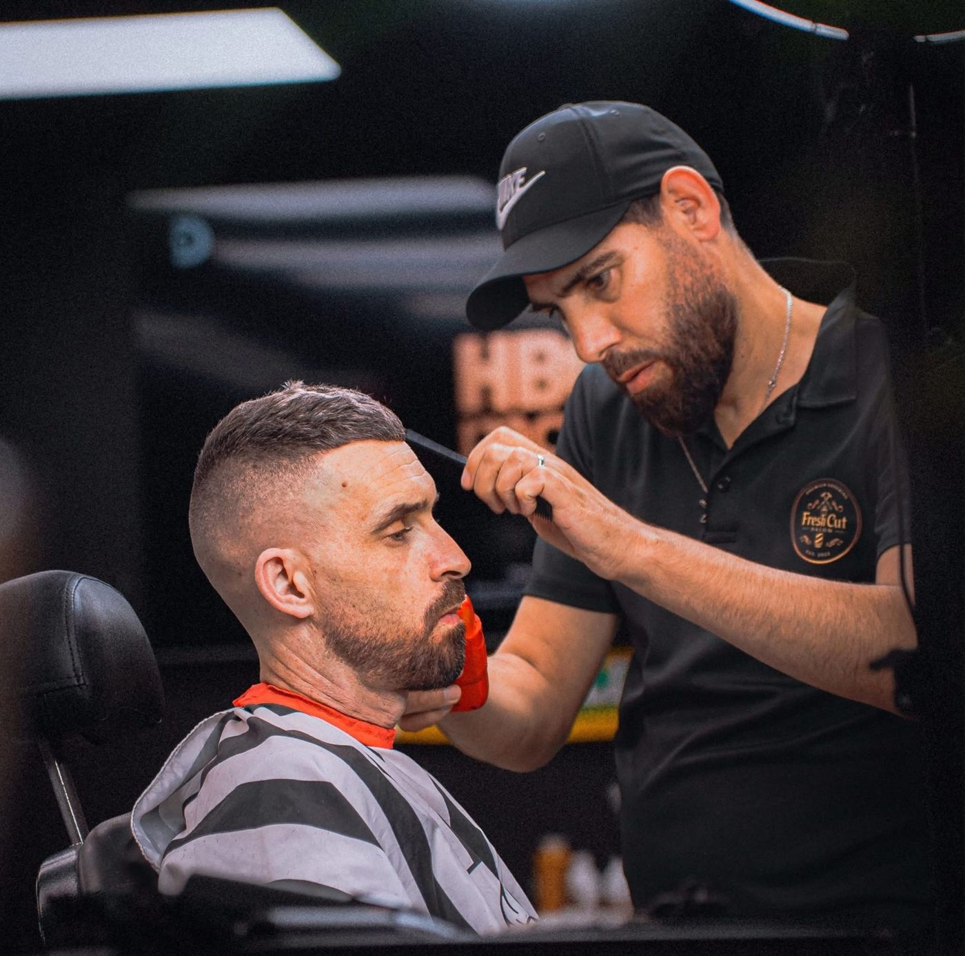 Barber giving a fresh cut at Fresh Cut Salon